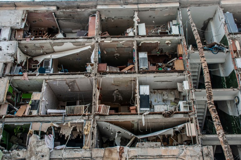 A view of destroyed apartments damaged by shelling, in Kharkiv, Ukraine, Sunday, March 13, 2022. (AP Photo/Andrew Marienko)