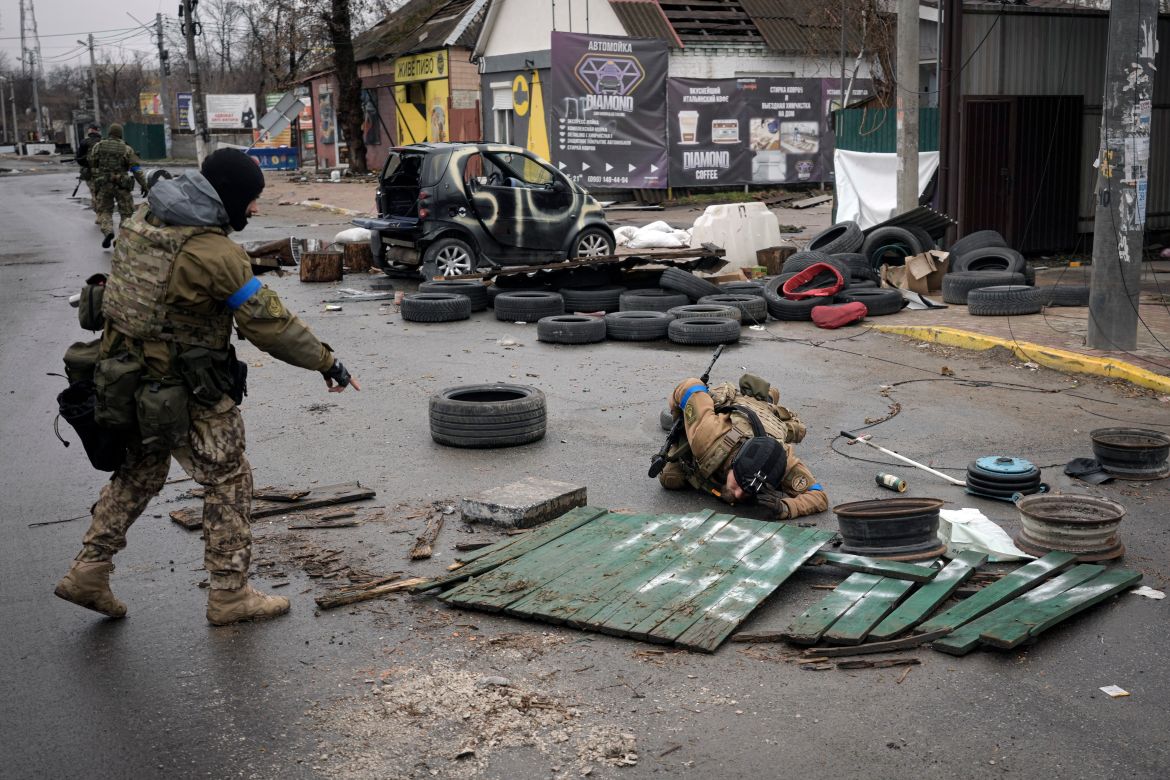 Ukrainian servicemen check streets for booby traps