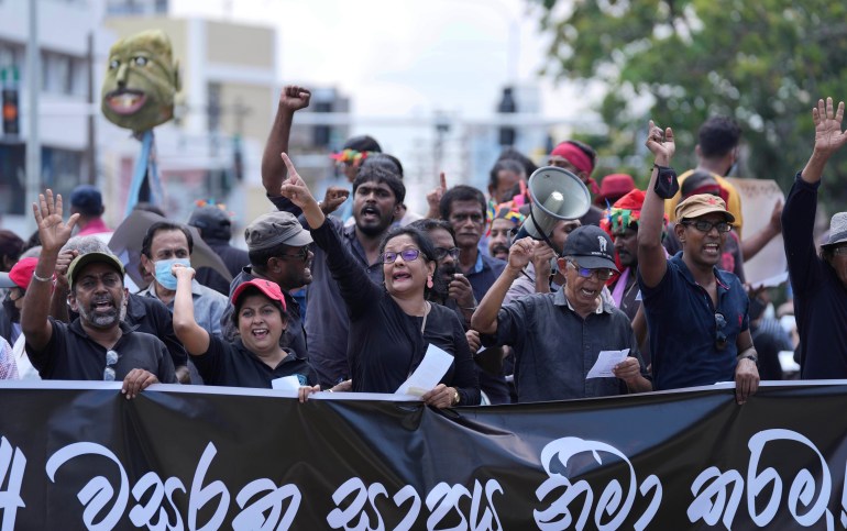 Sri Lankans protest demanding president Gotabaya Rajapaksa resign, in Colombo, Sri Lanka, Tuesday, April 5, 2022. 