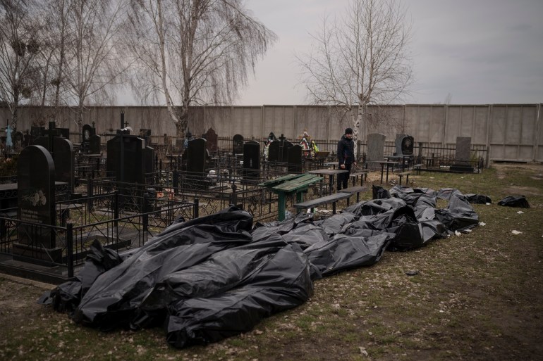 Dozens of bodies wait to be buried at a cemetery in Bucha, outskirts of Kyiv