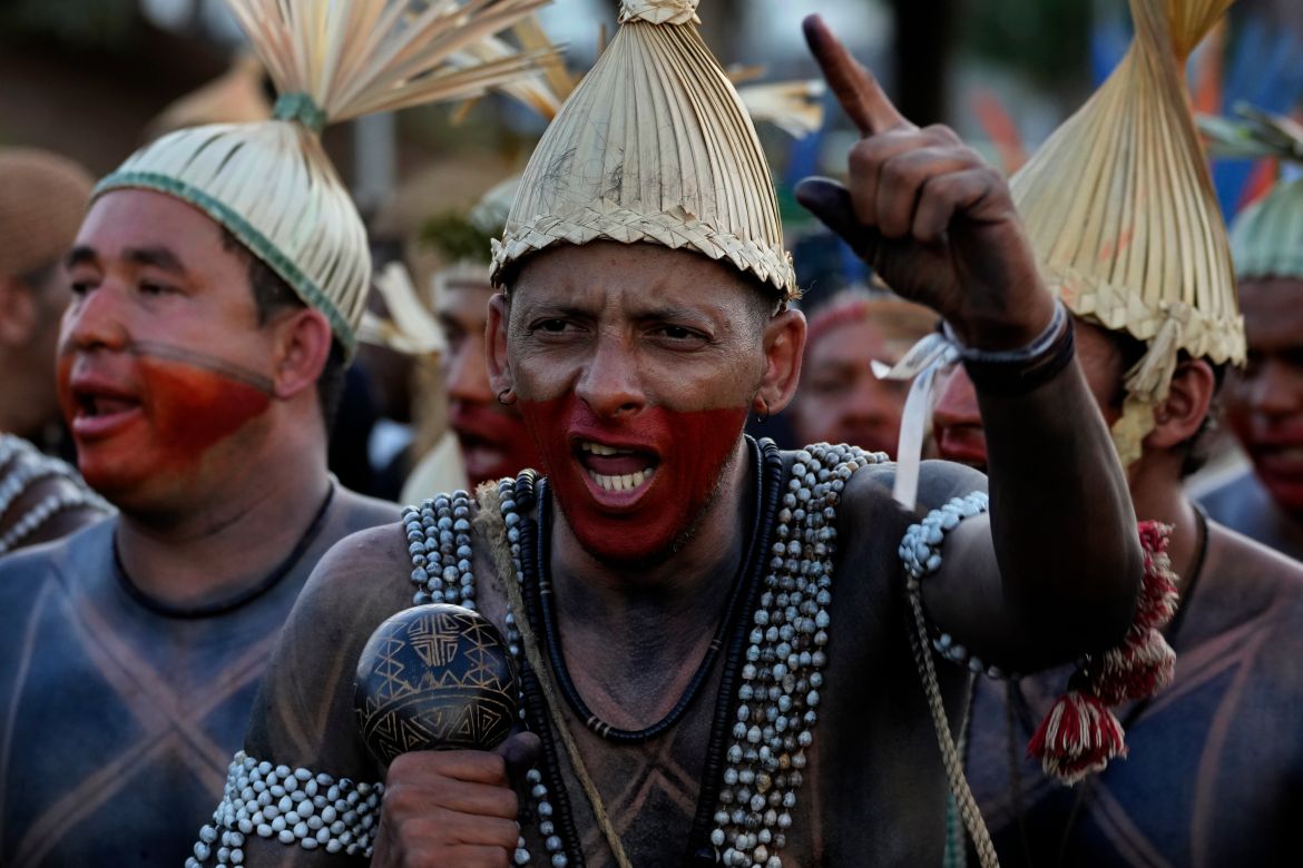 A Xukuru Indigenous man performs during the March