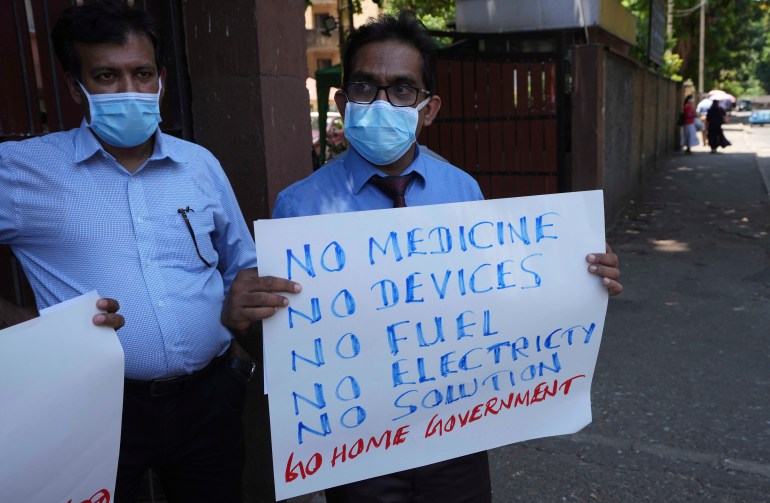 Sri Lankan government medical officers protest outside the national hospital in Colombo, Sri Lanka, Thursday, April 7, 2022. 