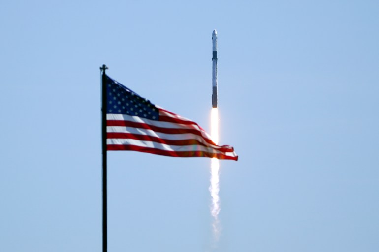 Rocket flies by US flag