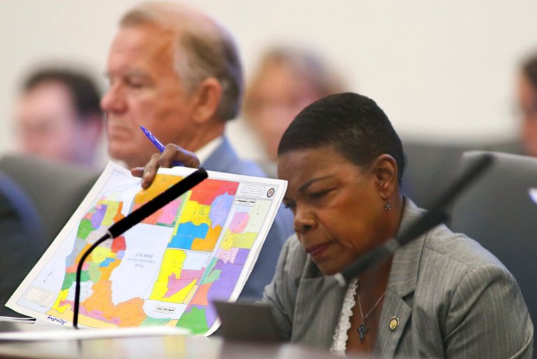 Florida State Senator Audrey Gibson, a Democrat, reviews proposed district maps during a Committee on Reapportionment meeting at the Capitol in Tallahassee, Florida. 