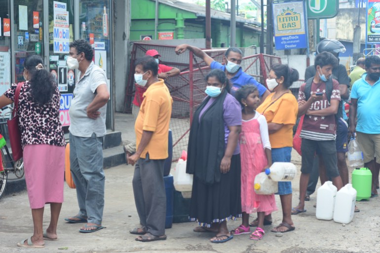 Sri Lankans are forced to line up for hours even in high temperatures to be able to purchase kerosene for cooking