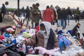 Refugees from Africa, the Middle East and India - mostly students of Ukrainian universities - gather at the Medyka pedestrian border crossing after fleeing the conflict in Ukraine, in eastern Poland on February 27, 2022 [Wojtek Radwanski /AFP]