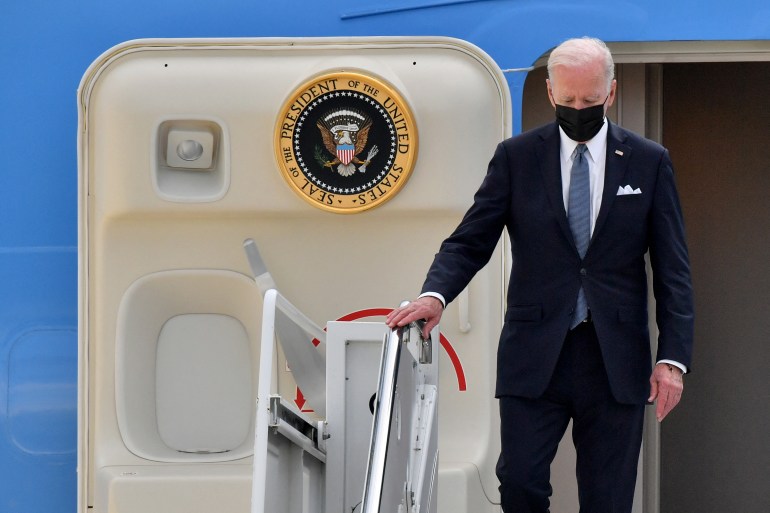 Biden disembarking from plane