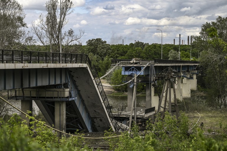 A photographs shows a downed bridge which connects the city of Lysychansk with the city of Severodonetsk in the eastern Ukranian region of Donba