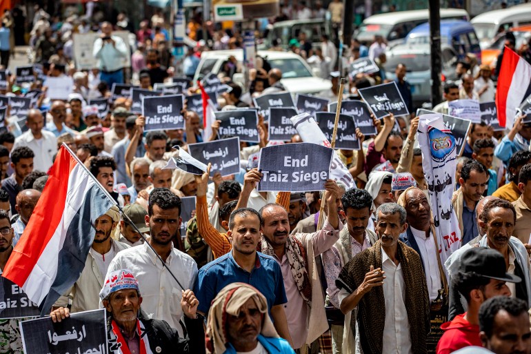 People in Taiz, Yemen, gather for a demonstration demanding the end of a years-long siege