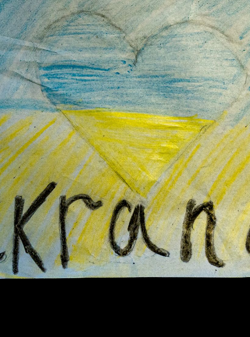 A child's drawing with 'I love Ukraine'
