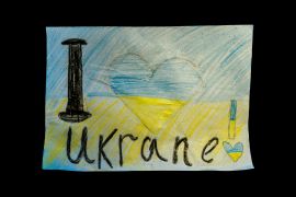 A child's drawing with 'I love Ukraine'