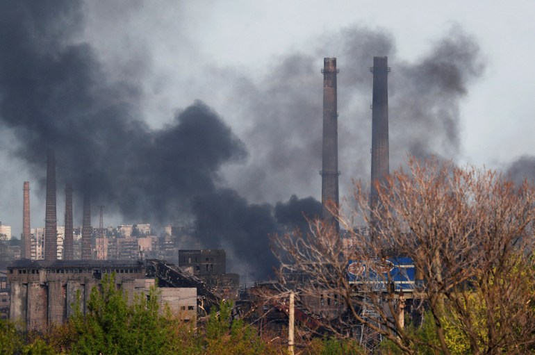 Smoke rises above a plant of Azovstal Iron and Steel Works during Ukraine-Russia conflict in the southern port city of Mariupol.