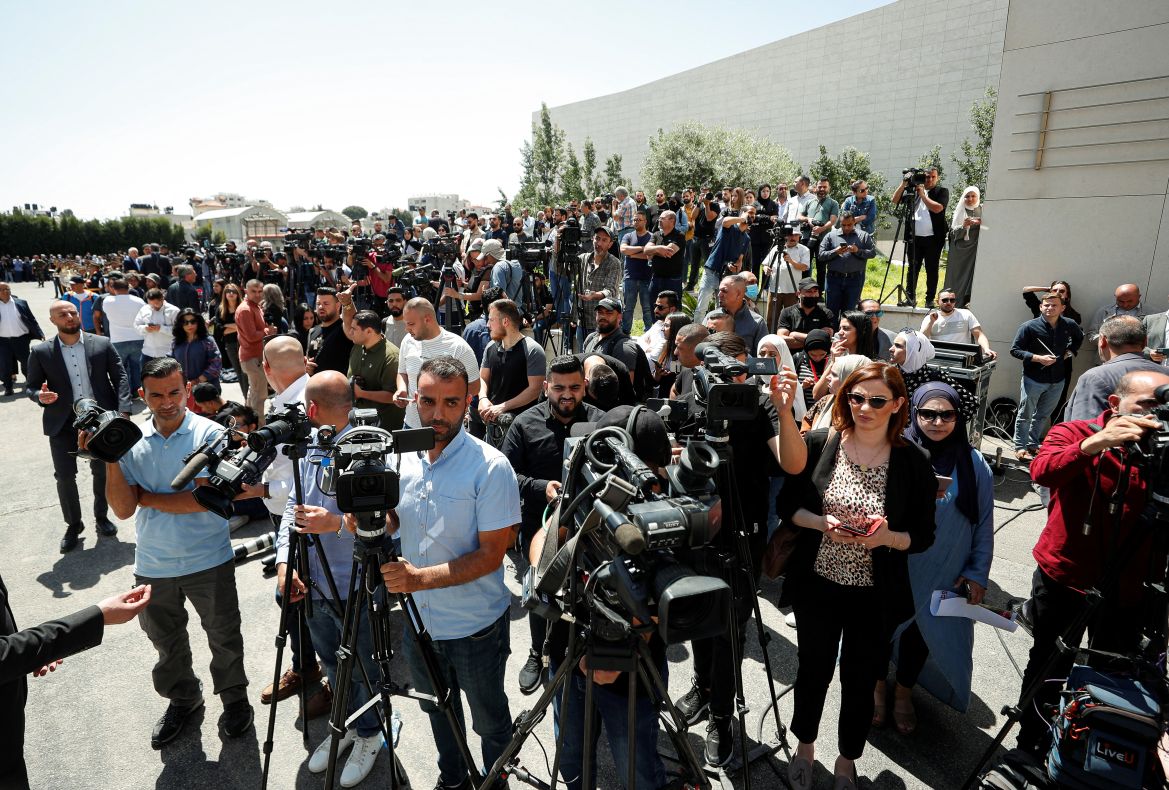 Palestinians attend a state service for veteran Al-Jazeera journalist Shireen Abu Akleh