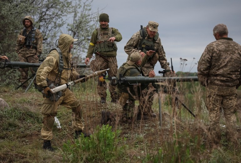 Ukrainian servicemen of the Territorial Defence Forces use an anti-tank grenade launcher as they take part in a training exercise, amid Russia's invasion of Ukraine, in Dnipropetrovsk region