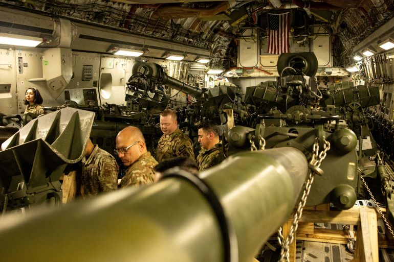 US Marines are seen loading an M777 towed 155 mm howitzer into the cargo hold of a US Air Force C-17 Globemaster III transport plane, to be delivered in Europe for Ukrainian forces