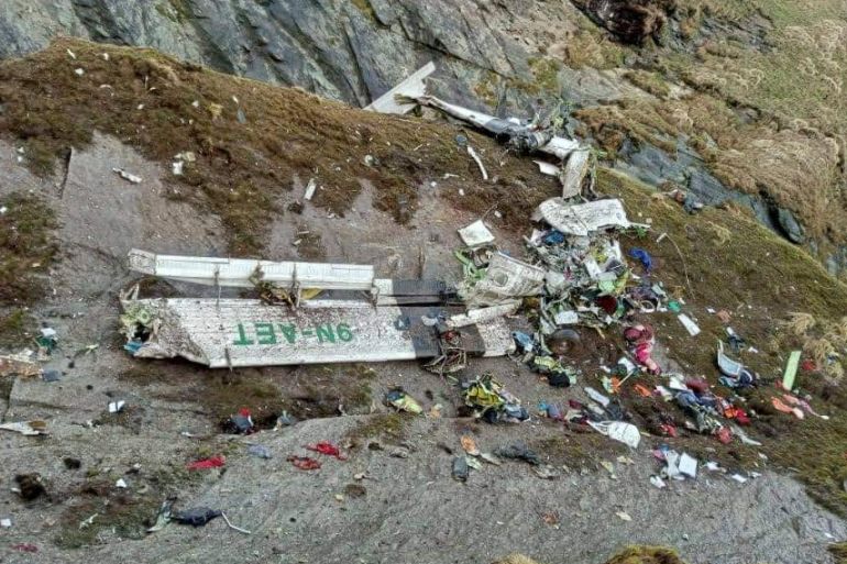 A general view of a Tara Air plane crash site during the rescue operation at Thasang