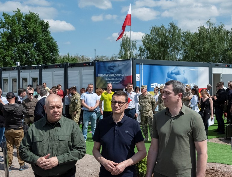 Polish Prime Minister Mateusz Morawiecki is seen attending the opening ceremony of a temporary shelter built with the help of Polish government for those who lost their apartments in the war, amid Russia's attack on Ukraine, in Borodianka 