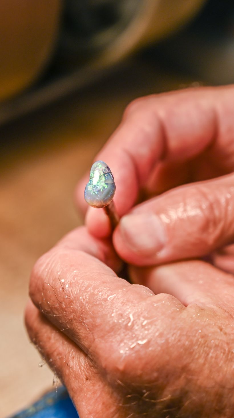 A photo of an opal part-way through the cutting process.