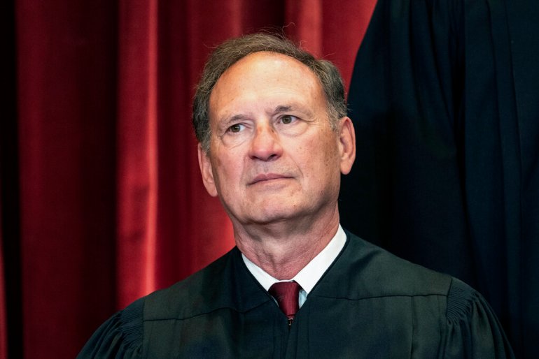 Associate Justice Samuel Alito sits during a group photo at the Supreme Court.