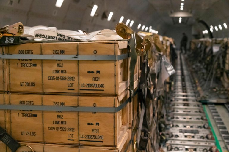 Pallets of ammunition, weapons and other equipment bound for Ukraine are loaded on a plane by members from the 436th Aerial Port Squadron during a foreign military sales mission at Dover Air Force Base.