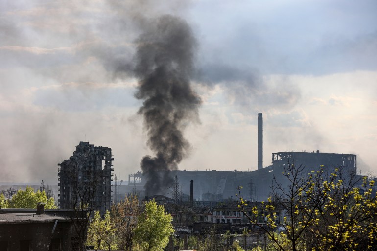 A plume of black smoke rises from the Azovstal steel works in Mariupol