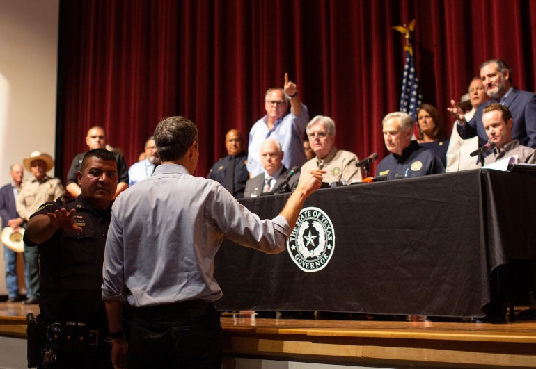 Democrat Beto O'Rourke, who is running against Texas Gov. Greg Abbott for governor this year, interrupts a news conference headed by Abbott after 19 children were shot dead at the Robb Elementary School