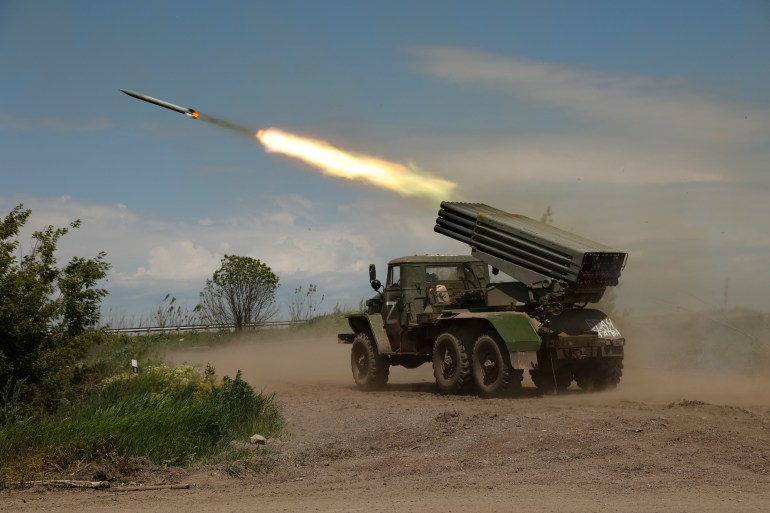 A Donetsk People's Republic militia's multiple rocket launcher fires from its position