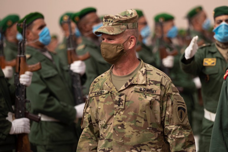 Gen. Christopher Cavoli, Commander of United States Army Europe and Africa, walks past a guard of honour as he arrives to attend the African Lion military exercise in Grier Labouihi complex, southern Morocco, June 9, 2021