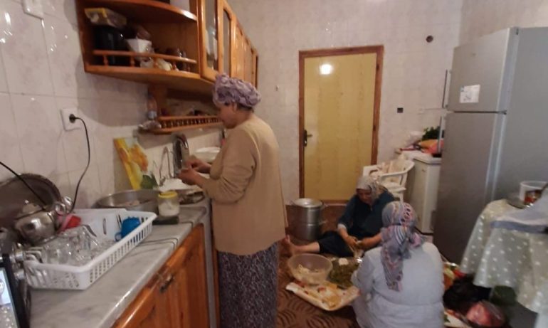 A photo of the author's aunts preparing a family meal