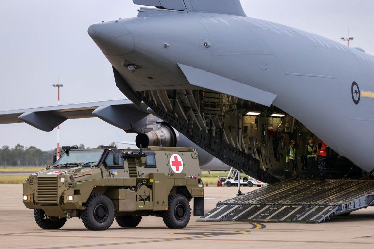 A Bushmaster PMV is loaded into a C-17 Globemaster.