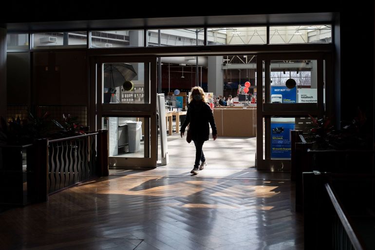 A shopper walks out of a store at the Southland Center shopping mall in Taylor, Michigan