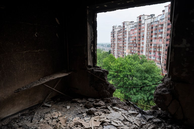 Debris cover the room of an apartment damaged during shelling in Kharkiv, eastern Ukraine, Saturday, May 21, 2022 