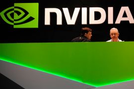 People gather in the Nvidia booth at the Mobile World Congress mobile phone trade show in Barcelona, Spain