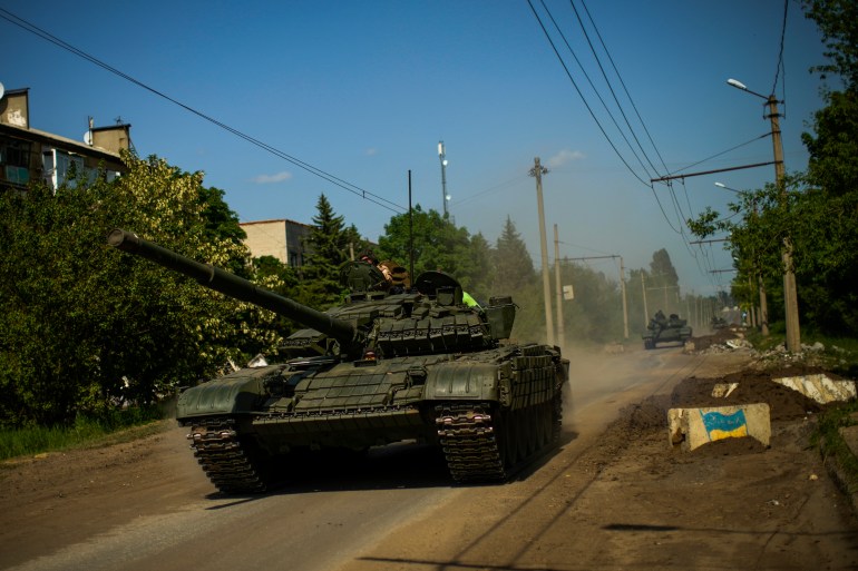 Ukrainian tanks move in Donetsk region, eastern Ukraine, Monday, May 30, 2022
