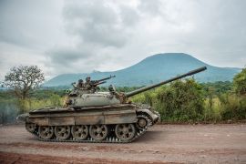 A Congolese army tank heads towards the frontlines on May 25, 2022 as DR Congo soldiers fought M23 rebels and the government appeared to implicate Rwanda in the violent flare-up [Arlette Bashizi/AFP]
