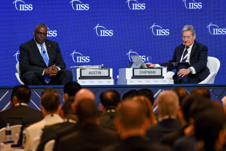 US Defense Secretary Lloyd Austin (on left) takes questions from the audience after his speech at the Shangri La Dialogue
