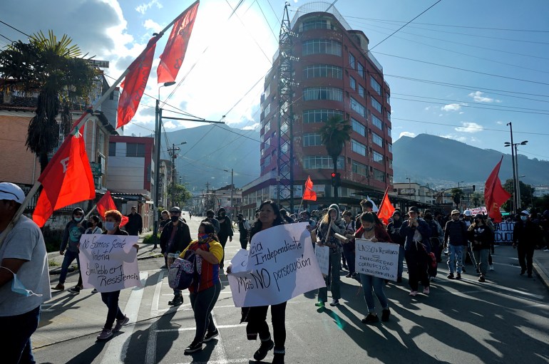 University students demonstrate in Quito with flags and banners