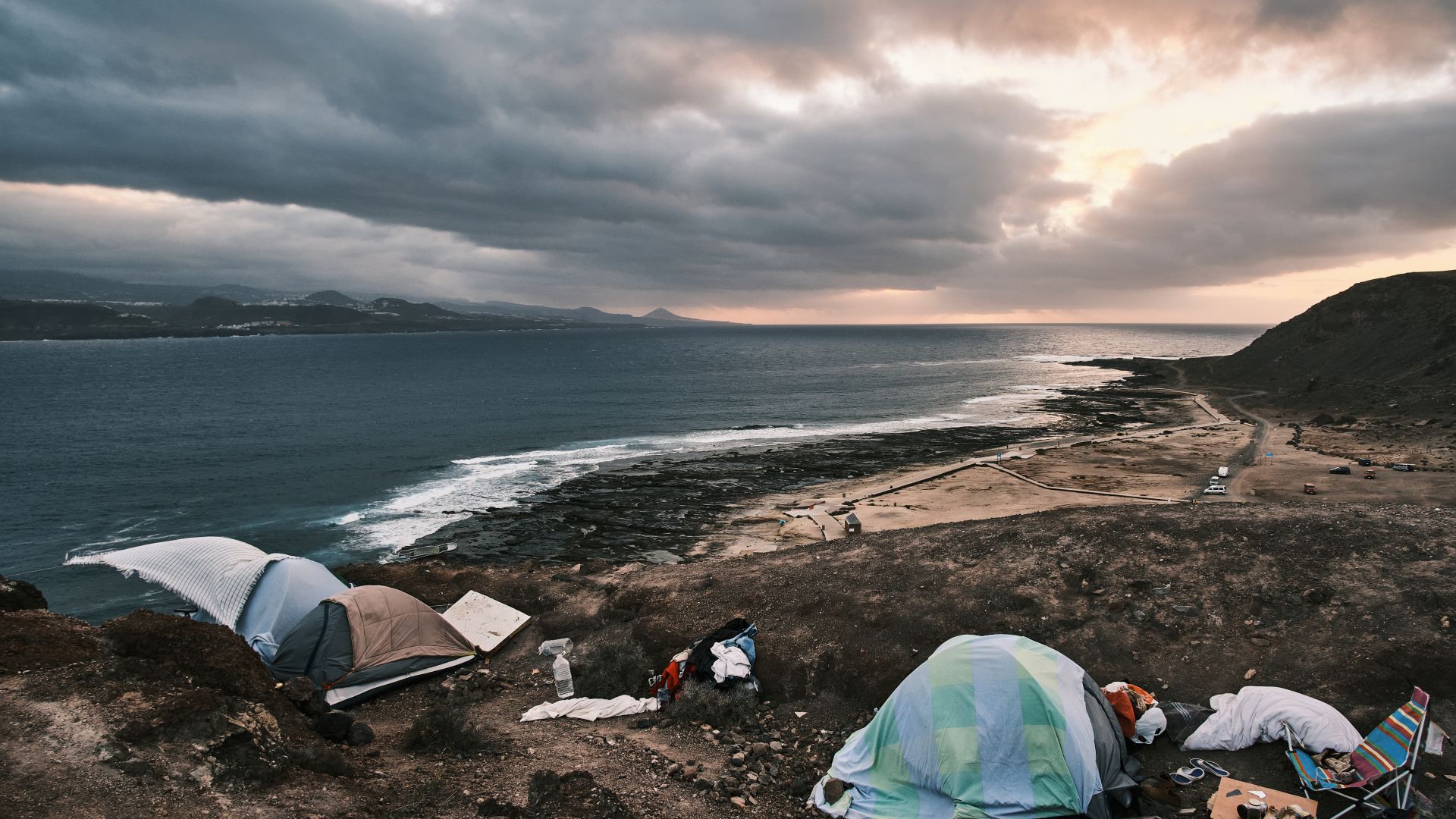 A photo of a makeshift shelter by the sea.