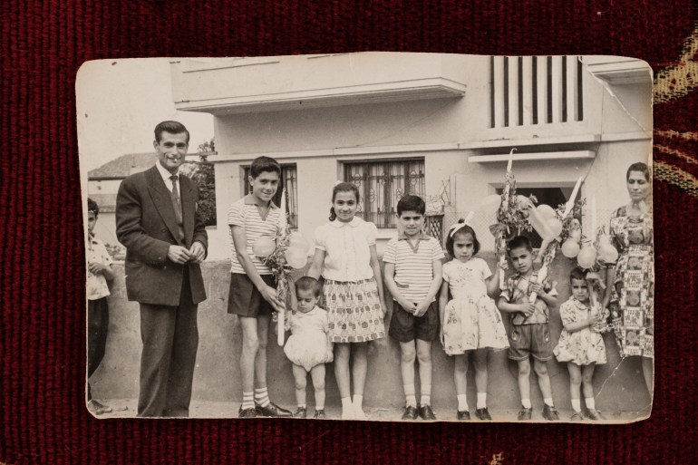 A family photo of the Moussa family during Palm Sunday. Salma Moussa is centre, fourth from left