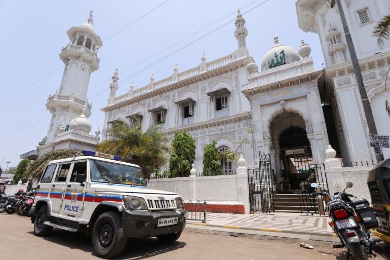 Police van parked outside a mosque