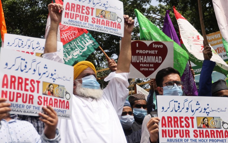 People holding placards shout slogans demanding the arrest of Bharatiya Janata Party (BJP) member Nupur Sharma for her blasphemous comments on the Prophet Muhammad, on a street in Mumbai, India.