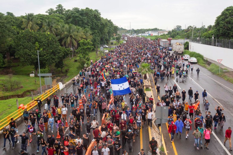 Migrants walk in a caravan in southern Mexico