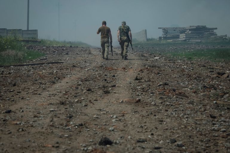 Ukrainian soldiers are seen on patrol in the country's eastern Donetsk region