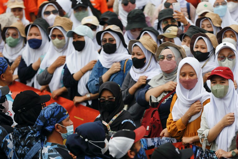 Women in Indonesia take part in a trade union protest against the new jobs law
