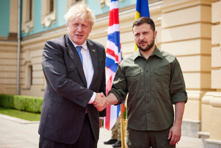 Ukraine's President Volodymyr Zelenskyy and British Prime Minister Boris Johnson shaking hands
