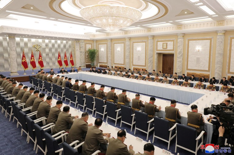 North Korean leader Kim Jong Un attends a meeting with military leaders.