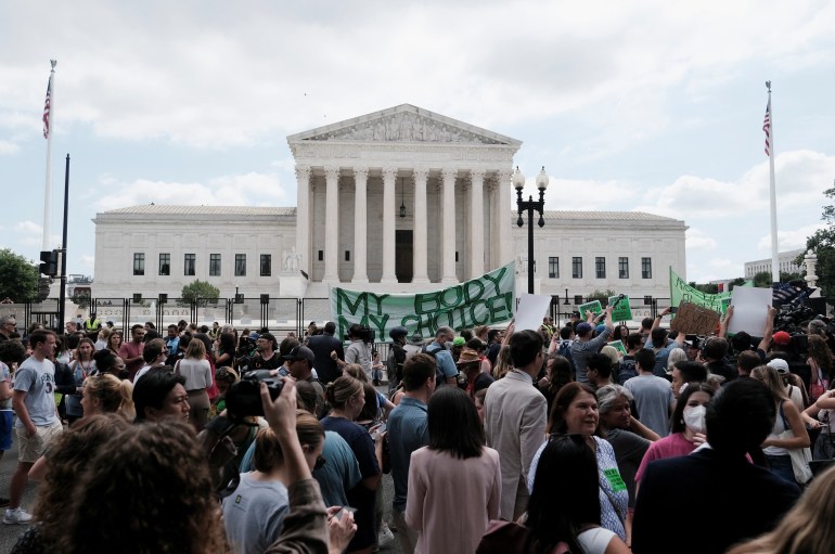 Demonstrators gather outside the United States Supreme Court