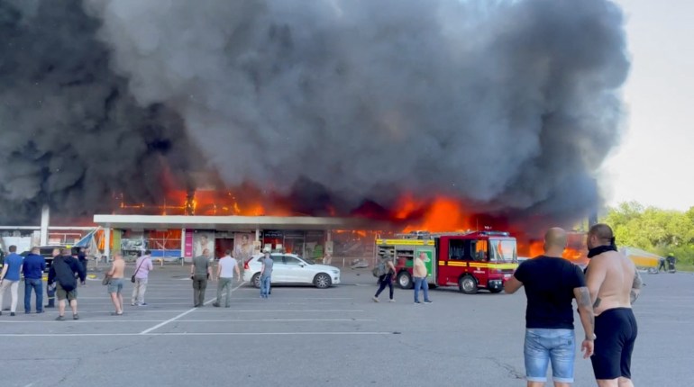 A shopping mall hit by a Russian missile strike in Kremenchuk, Ukraine on June 27, 2022 [Telegram/V_Zelenskyy_official/Reuters]