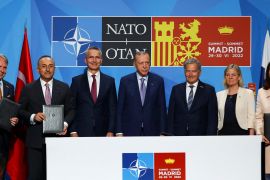 Turkish President Tayyip Erdogan, Finland's President Sauli Niinisto, Sweden's Prime Minister Magdalena Andersson and NATO Secretary General Jens Stoltenberg deliver a statement during a NATO summit in Madrid, Spain [File:Violeta Santos Moura/Reuters]