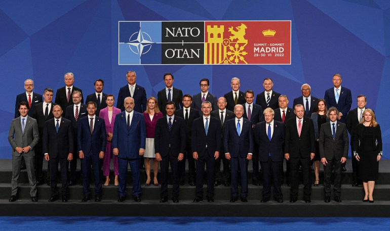 NATO leaders gathered for a key summit in Madrid, Spain, pose for a group picture.